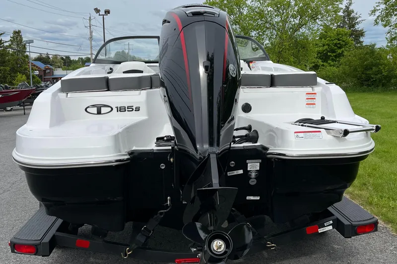 Slide: The Image of 2025 Tahoe 185 S boat, rear view, on trailer, outdoors. - 5