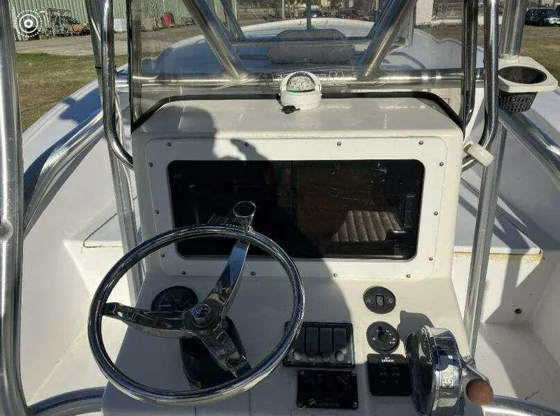 Slide: The Image of Cockpit of 1995 Custom 24 OPEN boat with steering wheel and gauges. - 14