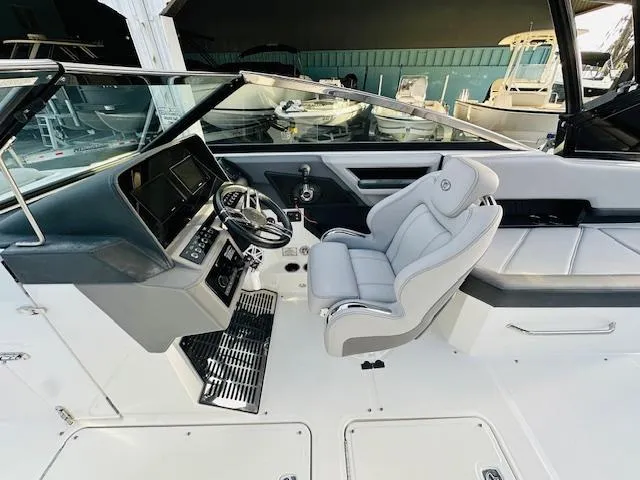 Slide: The Image of 2022 Cobalt R8 boat interior with modern helm and comfortable seating. - 14