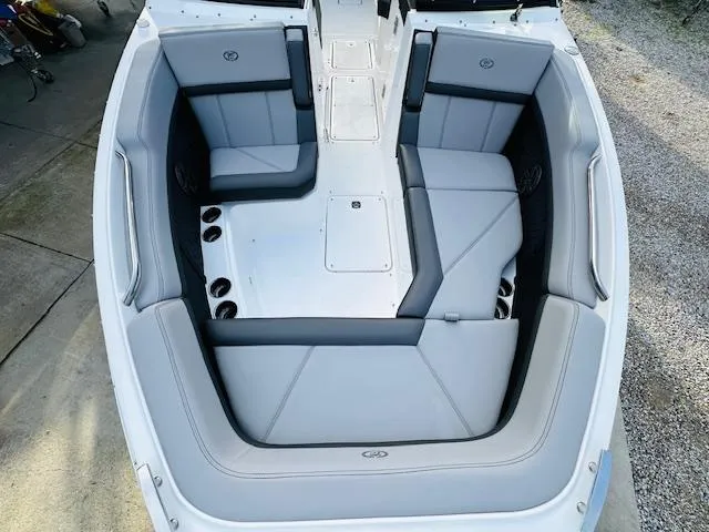 Slide: The Image of 2022 Cobalt R8 boat interior with gray seating and cup holders. - 21