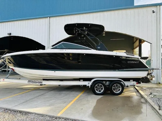 Slide: The Image of 2022 Cobalt R8 boat on trailer outside a large storage facility. - 4