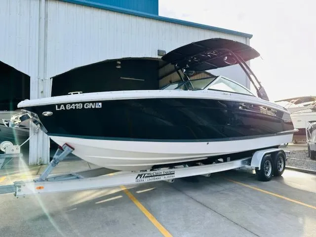 Slide: The Image of 2022 Cobalt R8 boat on trailer, parked outside a building. - 5