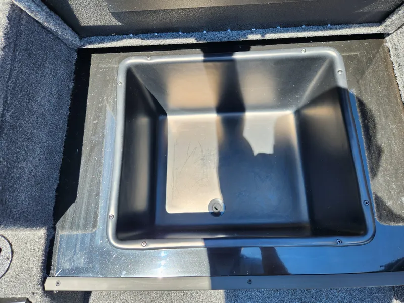 Slide: The Image of Storage compartment of 2025 Tracker Savage 215 boat, featuring a spacious, durable design. - 16