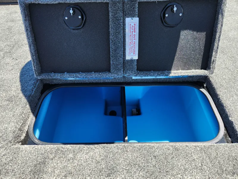 Slide: The Image of 2025 Tracker Savage 215 boat storage compartment with blue interior and dual locking lids. - 20