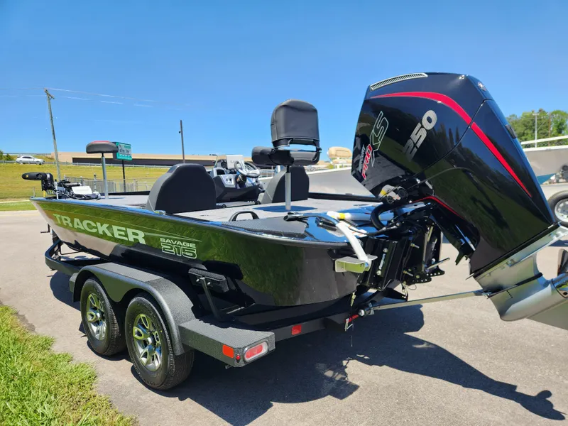 Slide: The Image of 2025 Tracker Savage 215 boat with powerful outboard motor on a trailer. - 6