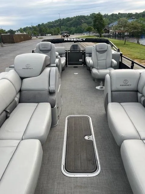 Slide: The Image of 2024 Regency 250LE3 pontoon boat with luxurious seating and spacious deck. - 9