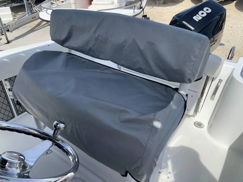 Slide: The Image of 2020 Wellcraft 222F boat seat with protective gray cover. - 7