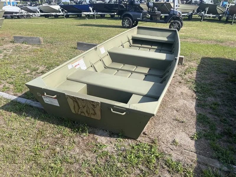 Slide: The Image of 2024 Lowe 1240 boat on grass, showcasing its sturdy design and spacious interior. - 3