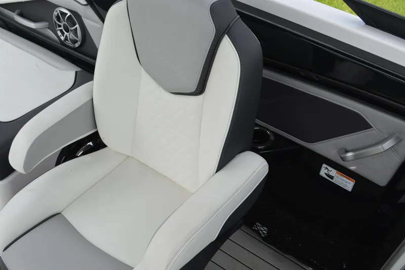 Slide: The Image of 2021 Yamaha Boats 252SD interior seat with modern design and speaker detail. - 11