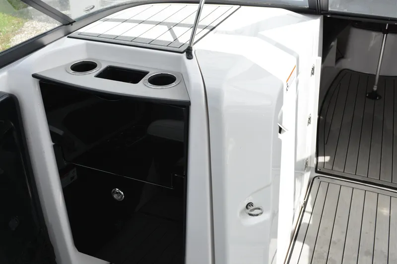 Slide: The Image of 2021 Yamaha Boats 252SD interior with cup holders and sleek design. - 12