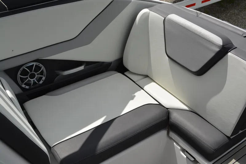 Slide: The Image of 2021 Yamaha Boats 252SD interior seating with sleek design and integrated speaker. - 13