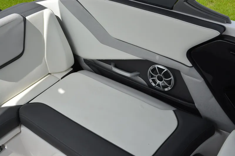 Slide: The Image of 2021 Yamaha Boats 252SD interior with sleek seating and built-in speaker. - 14