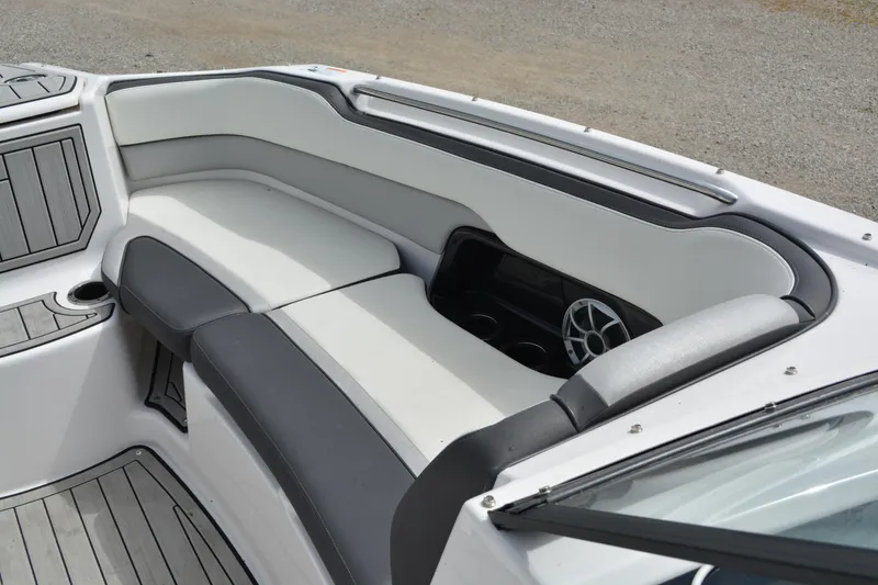 Slide: The Image of 2021 Yamaha Boats 252SD interior with cushioned seating and speaker system. - 17