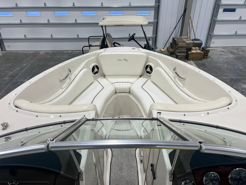 Slide: The Image of 2008 Sea Ray 230 Select boat interior with white seating and dashboard view. - 14