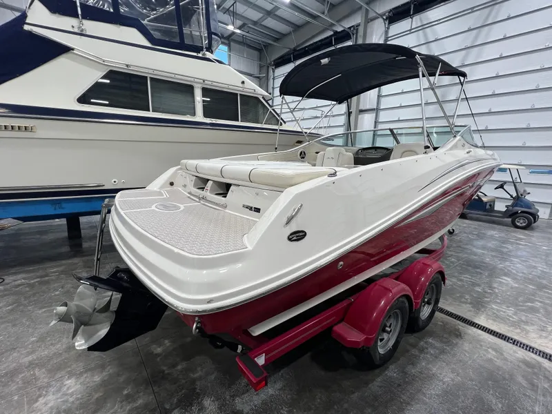 Slide: The Image of 2008 Sea Ray 230 Select boat on trailer in indoor storage facility. - 2