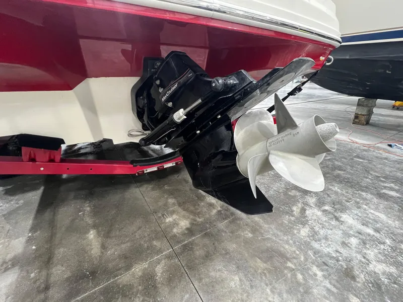 Slide: The Image of 2008 Sea Ray 230 Select boat stern with propeller and outdrive in a garage. - 20