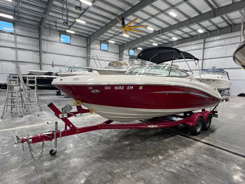 Slide: The Image of 2008 Sea Ray 230 Select boat on trailer in indoor storage facility. - 5