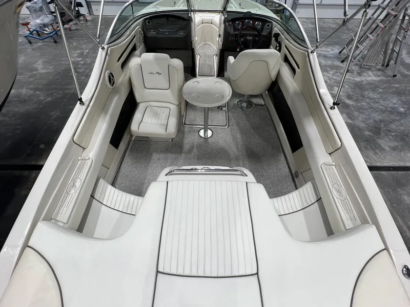 Slide: The Image of 2008 Sea Ray 230 Select boat interior with white seating and dashboard. - 6