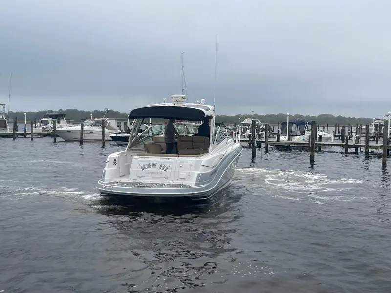 Slide: The Image of 2014 Four Winns Vista 375 boat in marina, overcast sky, calm water. - 10