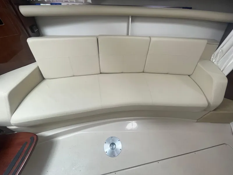 Slide: The Image of Cream leather seating in 2014 Four Winns Vista 375 boat interior. - 23