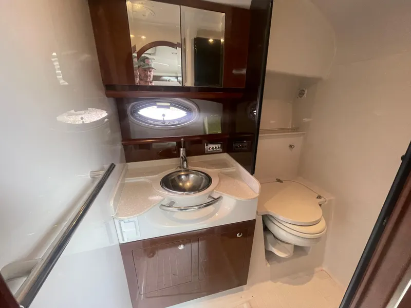 Slide: The Image of Luxurious bathroom in 2014 Four Winns Vista 375 yacht with sink, mirror, and toilet. - 27