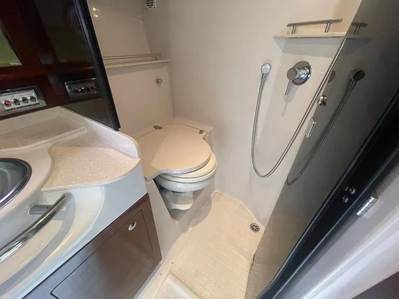 Slide: The Image of 2014 Four Winns Vista 375 bathroom with shower, toilet, and sink. - 30
