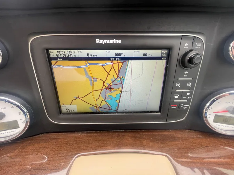 Slide: The Image of Raymarine navigation system on 2014 Four Winns Vista 375 boat dashboard displaying nautical map. - 39