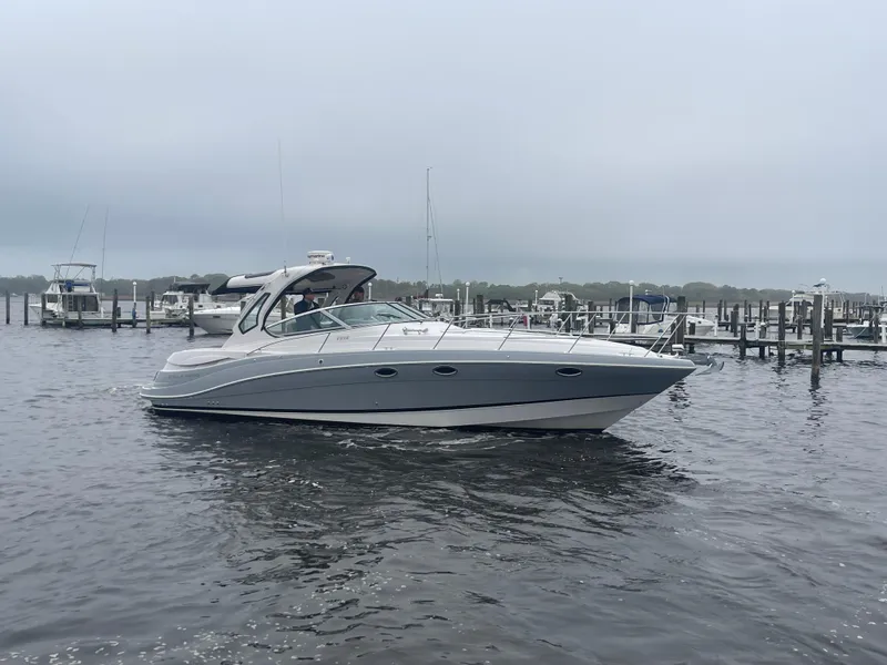 Slide: The Image of 2014 Four Winns Vista 375 boat on a calm marina waterway. - 4