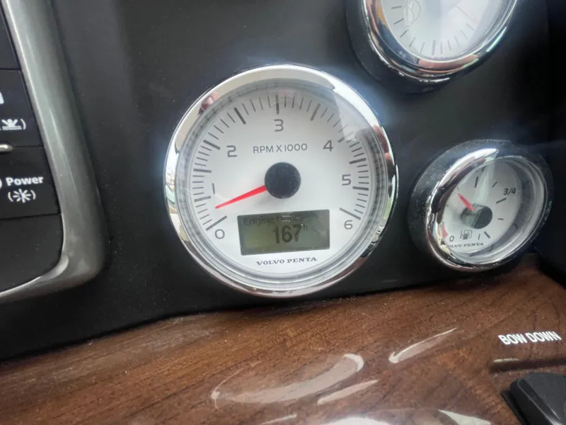 Slide: The Image of Dashboard gauges of a 2014 Four Winns Vista 375 boat, showing RPM and engine temperature. - 45