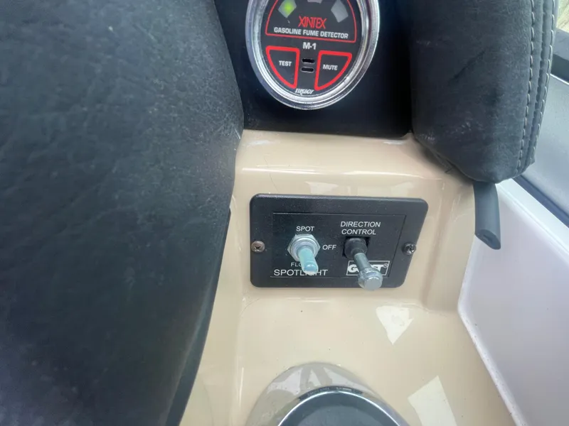 Slide: The Image of Control panel of a 2014 Four Winns Vista 375 boat with spotlight and fume detector. - 48
