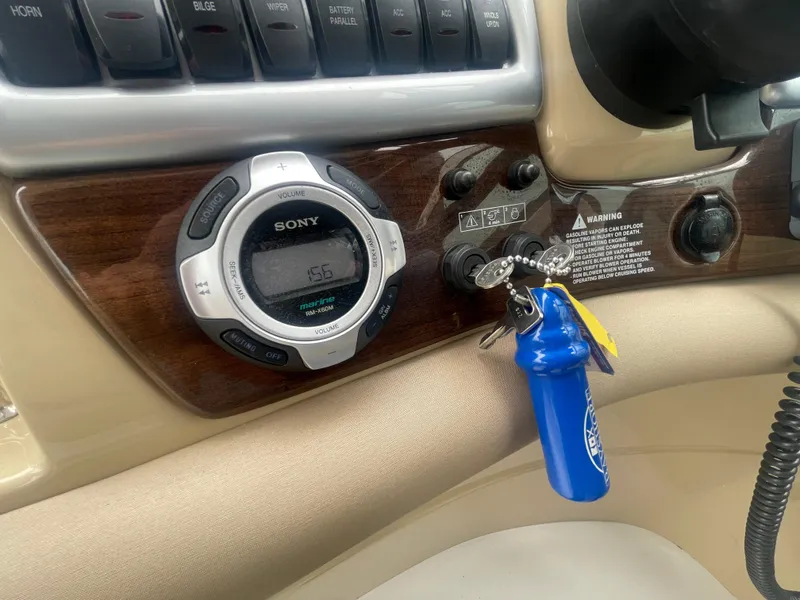 Slide: The Image of Control panel of a 2014 Four Winns Vista 375 boat with Sony stereo and ignition keys. - 49