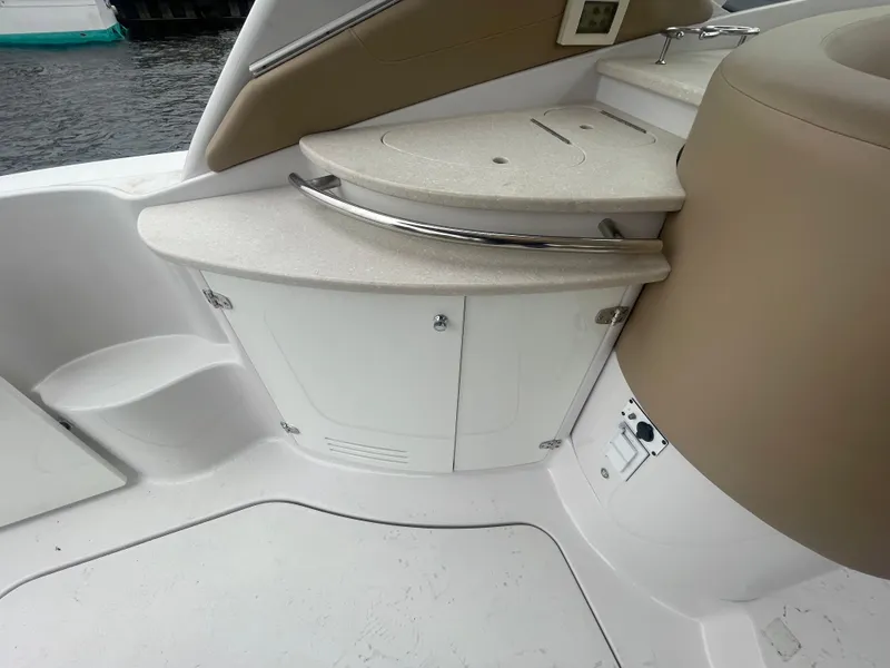 Slide: The Image of 2014 Four Winns Vista 375 boat interior with beige seating and white cabinetry. - 51