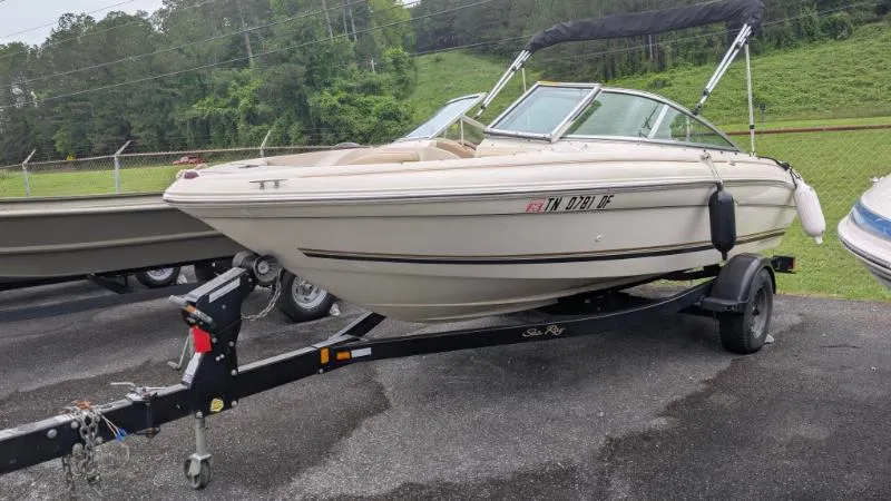 Slide: The Image of 2001 Sea Ray 185 Sport Boat on trailer, parked outdoors. - 0