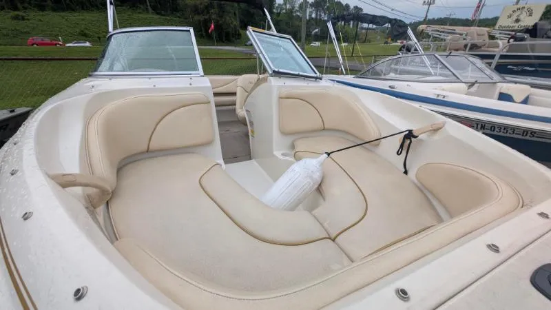 Slide: The Image of 2001 Sea Ray 185 Sport Boat with beige seating and open bow design. - 6
