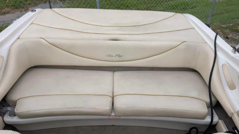 Slide: The Image of 2001 Sea Ray 185 Sport Boat interior seating, beige upholstery, rear view. - 7