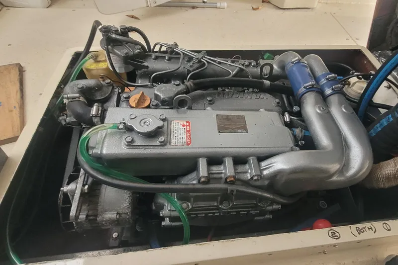 Slide: The Image of 1985 SISU Softtop Cruiser engine, detailed view of mechanical components and hoses. - 12