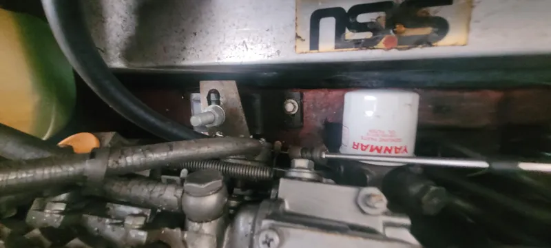 Slide: The Image of Engine components of a 1985 SISU Softtop Cruiser with visible Yanmar filter. - 14