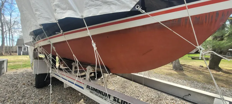 Slide: The Image of 1985 SISU Softtop Cruiser on trailer, covered, parked outdoors. - 16