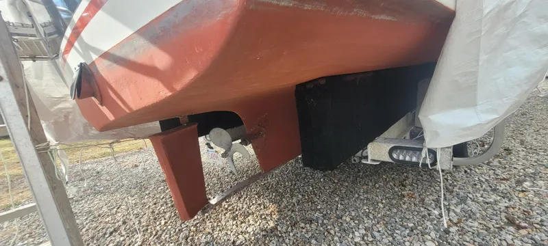 Slide: The Image of 1985 SISU Softtop Cruiser boat hull and propeller on gravel. - 17