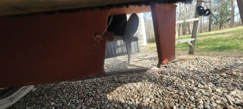 Slide: The Image of 1985 SISU Softtop Cruiser propeller and rudder on gravel surface. - 18