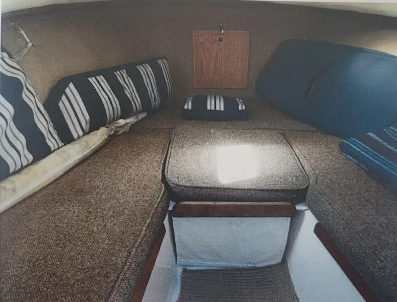Slide: The Image of 1985 SISU Softtop Cruiser interior with striped cushions and cozy seating area. - 2