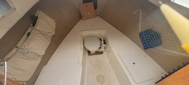 Slide: The Image of 1985 SISU Softtop Cruiser interior with toilet, cushions, and storage netting. - 3