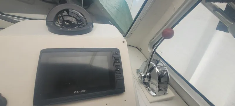 Slide: The Image of 1985 SISU Softtop Cruiser dashboard with Garmin GPS and throttle lever. - 5