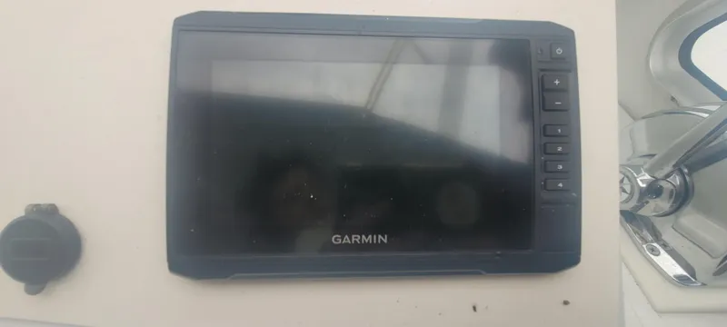 Slide: The Image of Garmin navigation device on 1985 SISU Softtop Cruiser dashboard. - 6