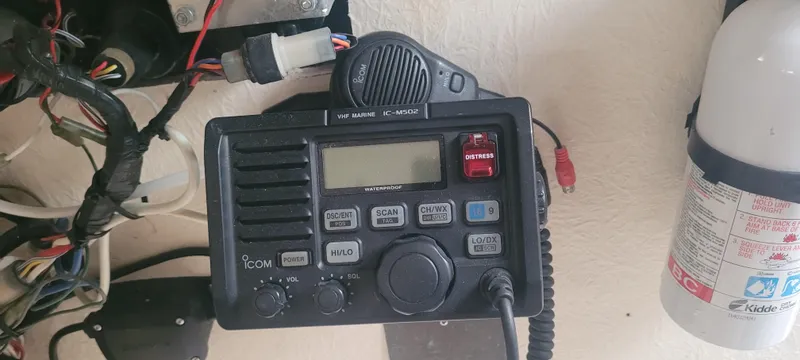 Slide: The Image of 1985 SISU Softtop Cruiser radio equipment with wiring and fire extinguisher. - 8