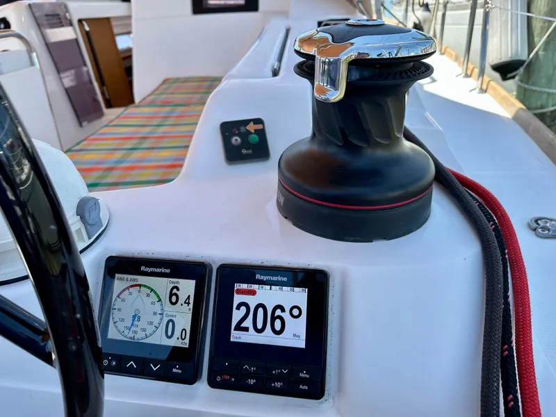 Slide: The Image of Cockpit of 2018 Jeanneau Sun Odyssey 419 with navigation instruments and winch. - 14