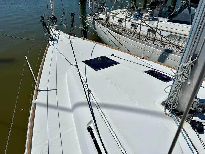 Slide: The Image of 2018 Jeanneau Sun Odyssey 419 sailboat deck, docked at marina. - 19