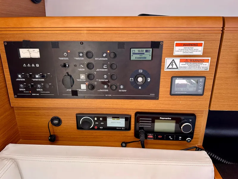 Slide: The Image of Control panel of 2018 Jeanneau Sun Odyssey 419 yacht with navigation and communication equipment. - 36