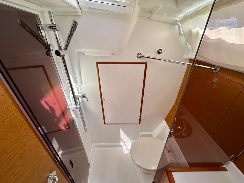 Slide: The Image of Bathroom interior of 2018 Jeanneau Sun Odyssey 419 yacht, featuring modern fixtures and wood accents. - 41