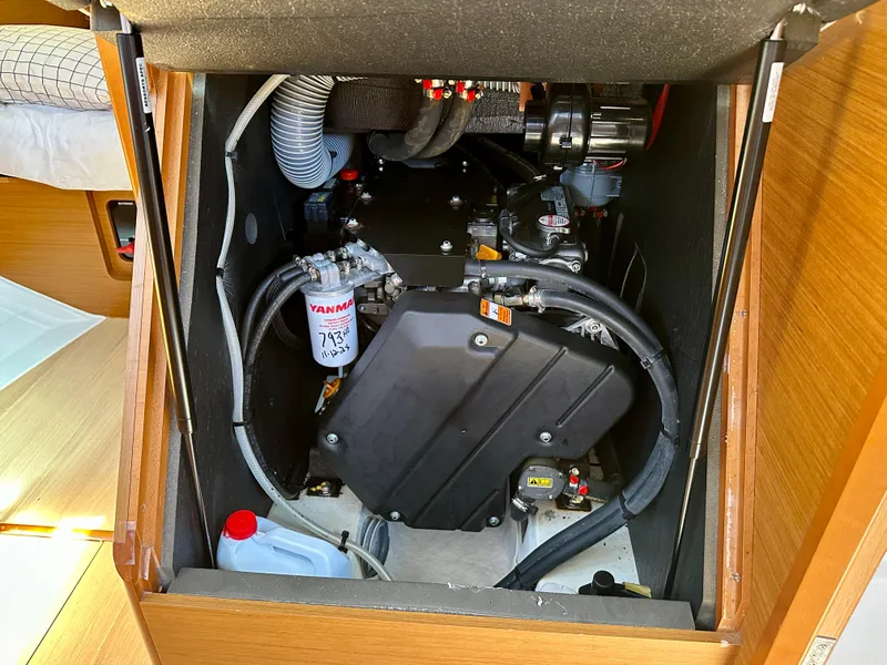 Slide: The Image of Engine compartment of 2018 Jeanneau Sun Odyssey 419 sailboat, featuring Yanmar engine components. - 46